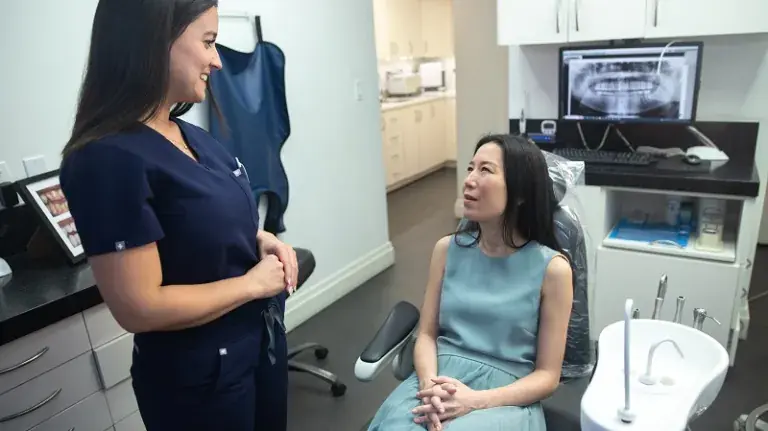 Patient being provided with detailed background and details regarding her dental treatment